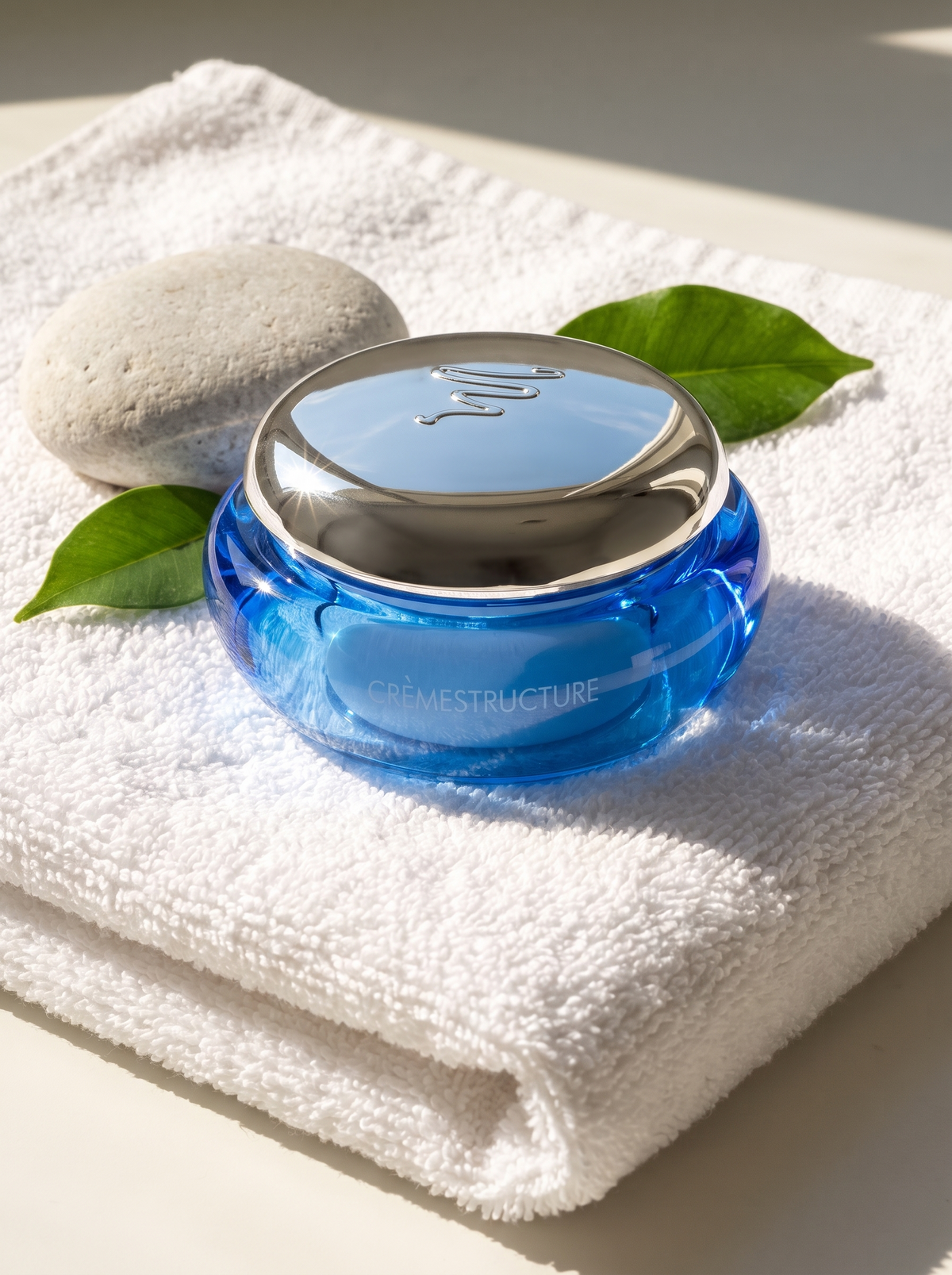 Ingrid Millet Crèmestructure – Spa-Mood auf Handtuch mit Stein und Blatt